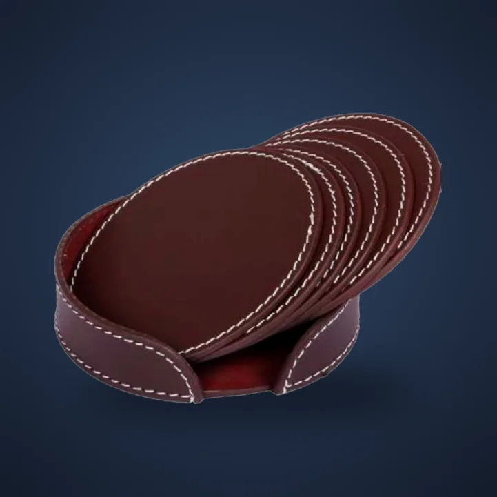 Set of burgundy stitched leather coasters with matching holder